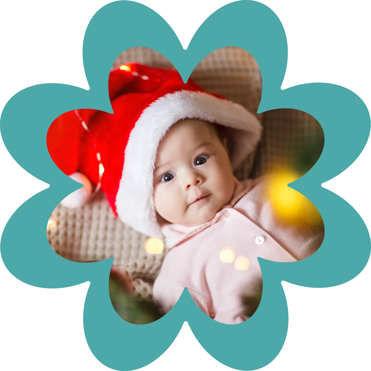 happy baby laying under christmas tree