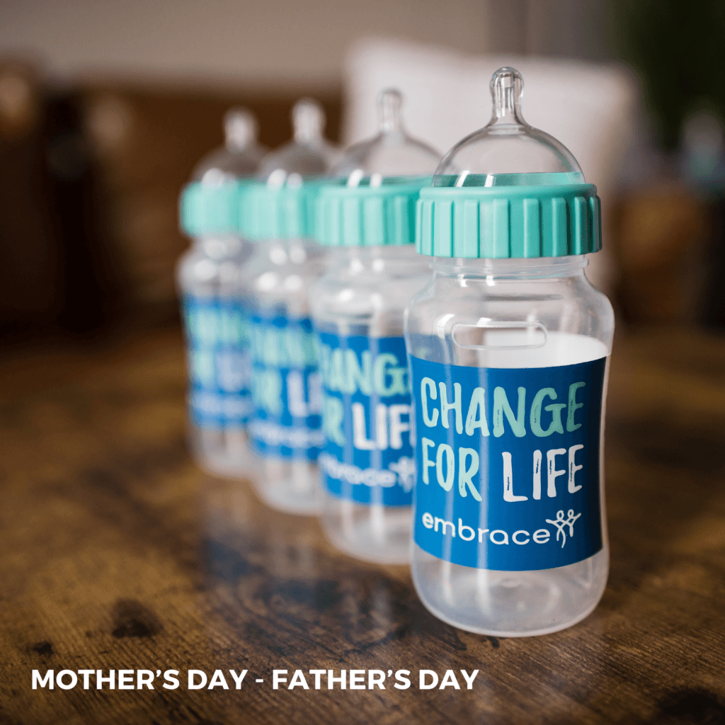A photo of multiple Change for Life baby bottles stacked side by side that reads "Mother's Day through Father's Day."